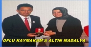 KAYMAKAM SUAT DERVİŞOĞLU'NA ALTIN MADALYA